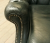 Pair Of Dark Green Leather Wing Chairs 