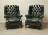 Pair Of Dark Green Leather Wing Chairs 