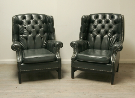 Pair Of Dark Green Leather Wing Chairs 